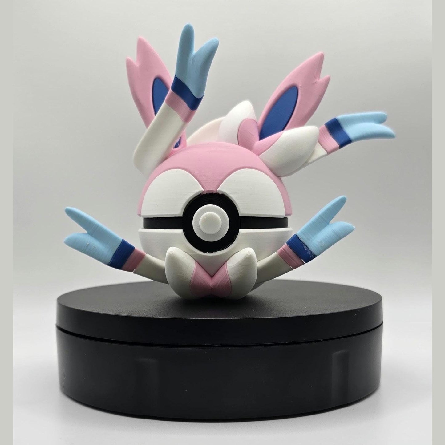 3D printed pastel pink fairy fusion creature ball with sculpted ribbon detail