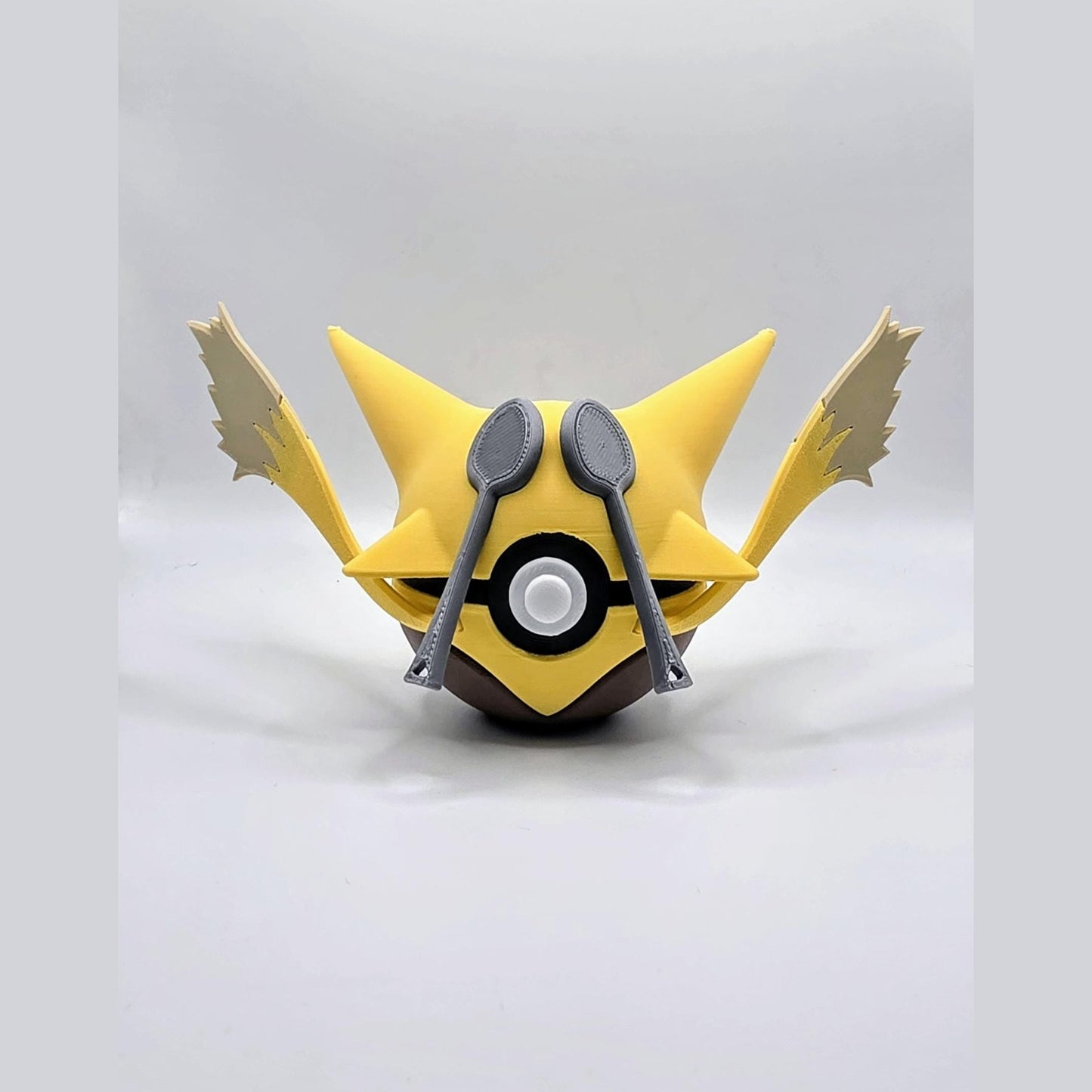 3D printed yellow psychic focus creature ball with purple arcane accents