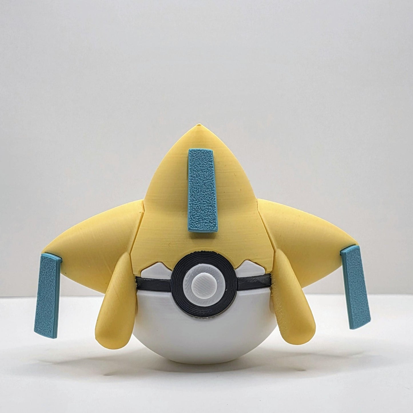 3D printed starry wishmaker creature ball with teal wish tag accents