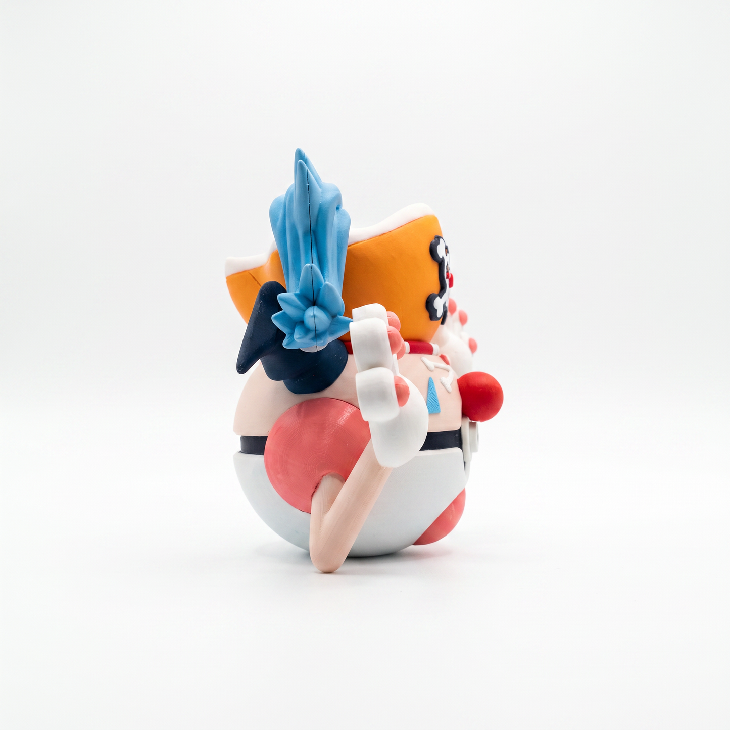 Close up of the creature ball showing red clown nose and red and white striped shirt body detail