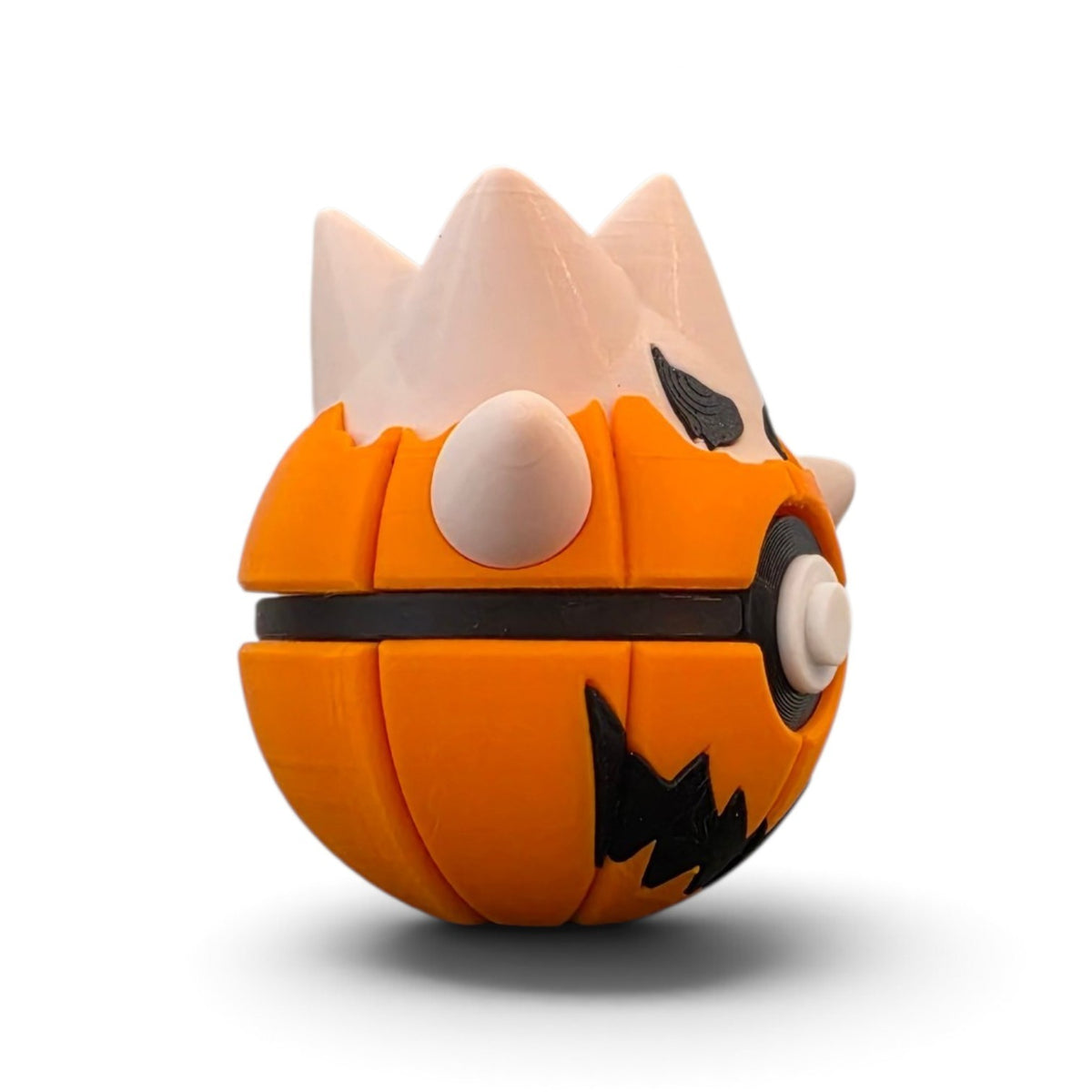 Jack-o-lantern egg hatchling creature ball close-up view