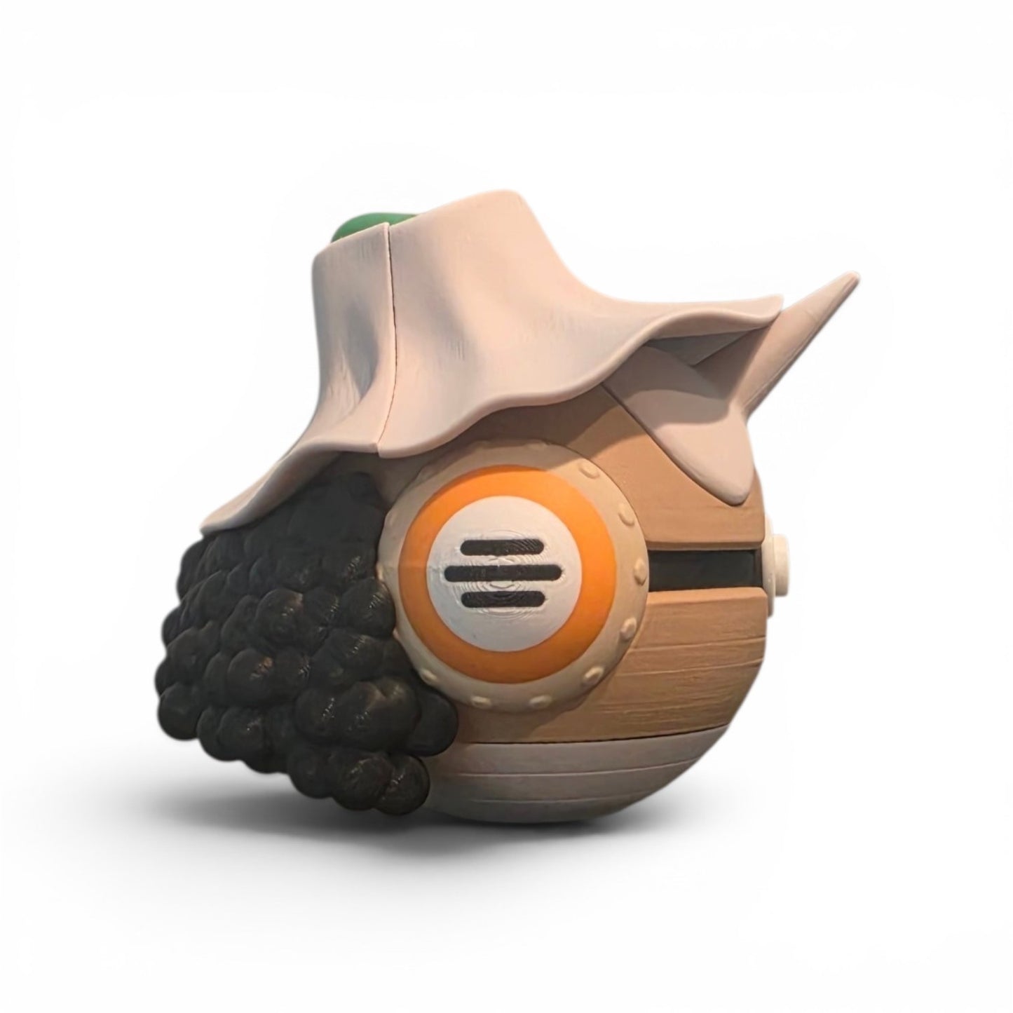 Close up of the creature ball showing brown body with orange ear detail and full silhouette profile
