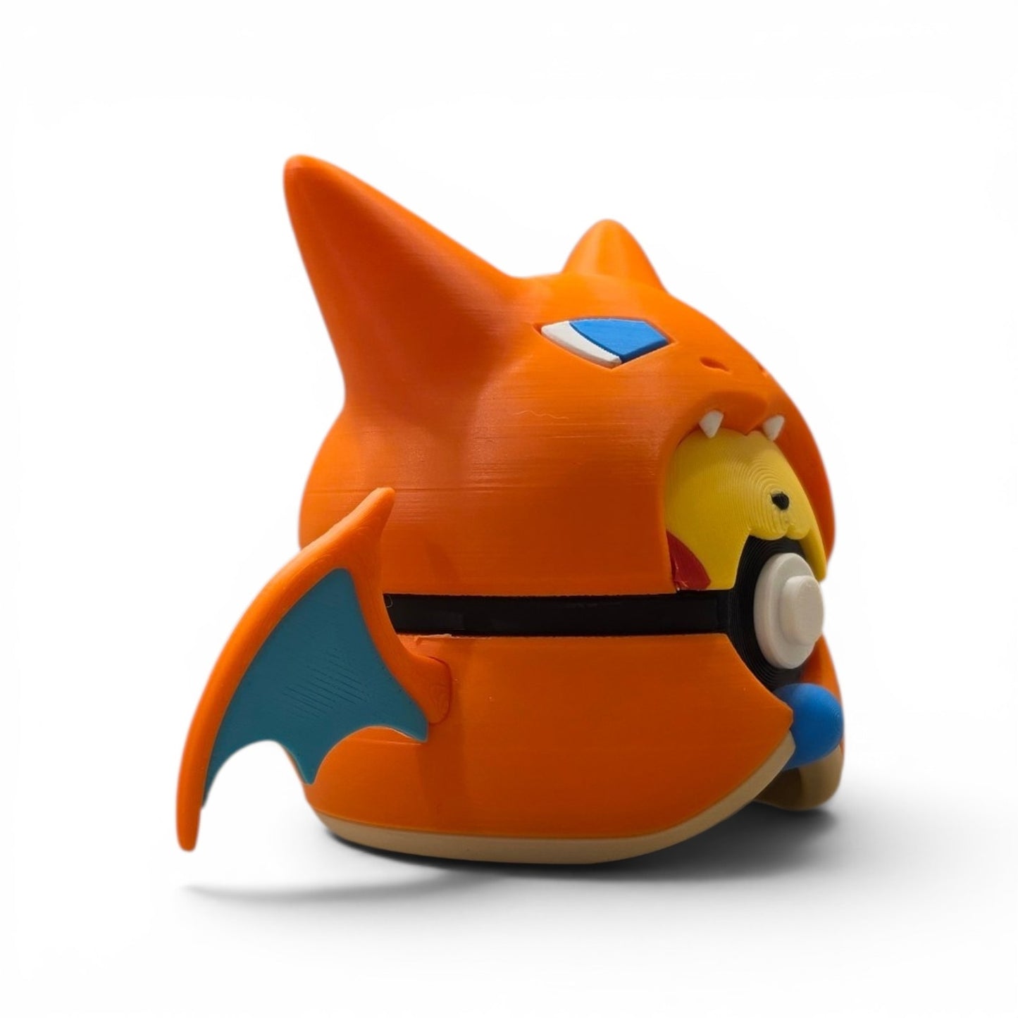 Close up of the creature ball showing yellow face with blue eye accents peeking through fire dragon costume