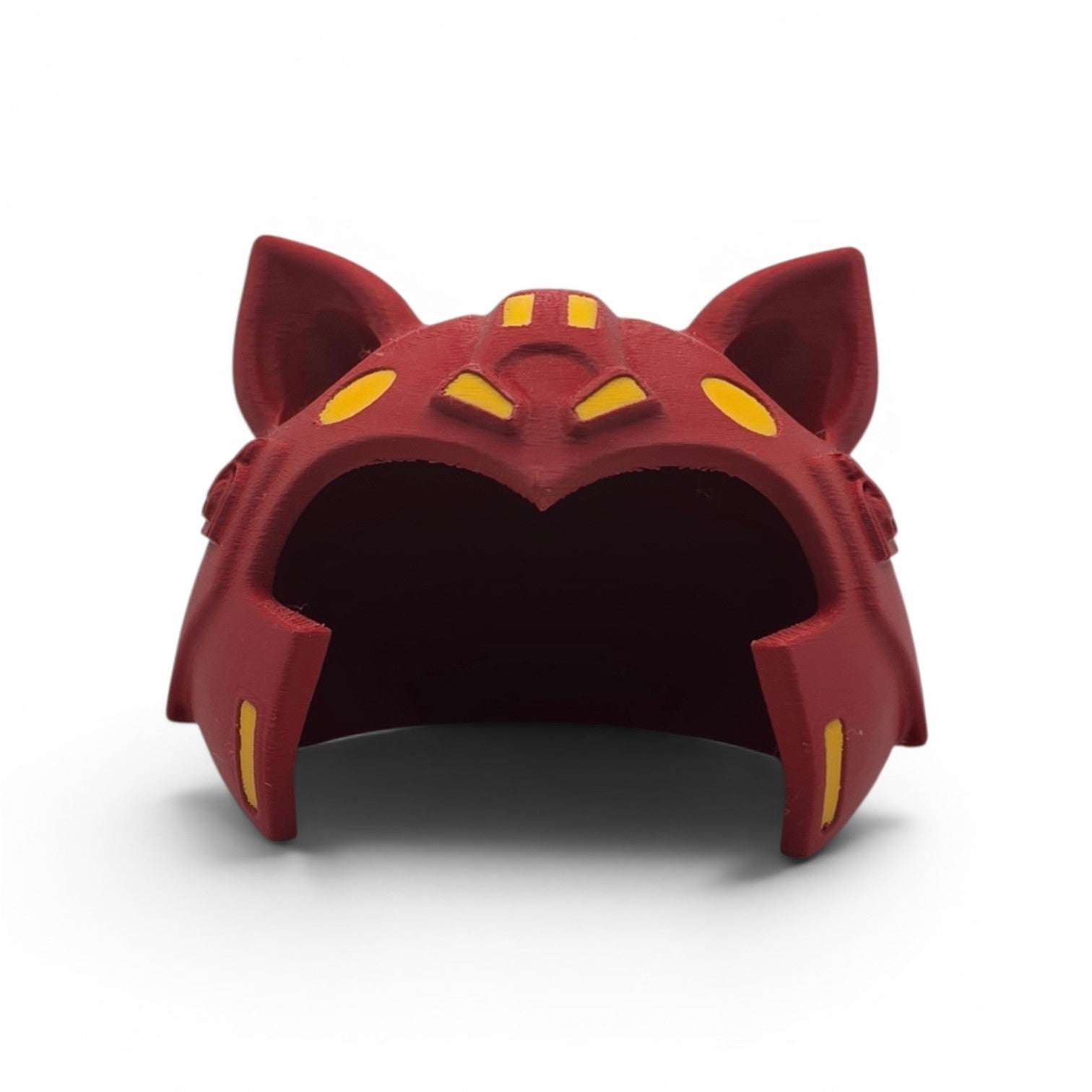Close up of the Battle Cat helmet showing pointed cat ears and yellow accent markings