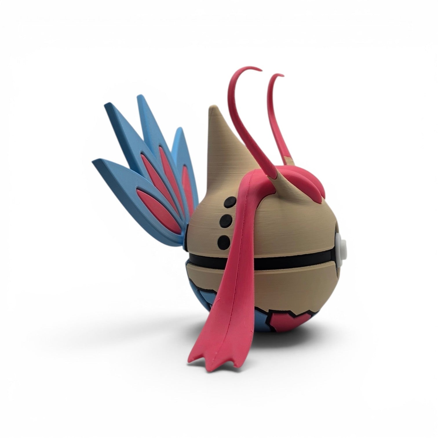 Close up of the creature ball showing pink antennae fins and cream upper body detail