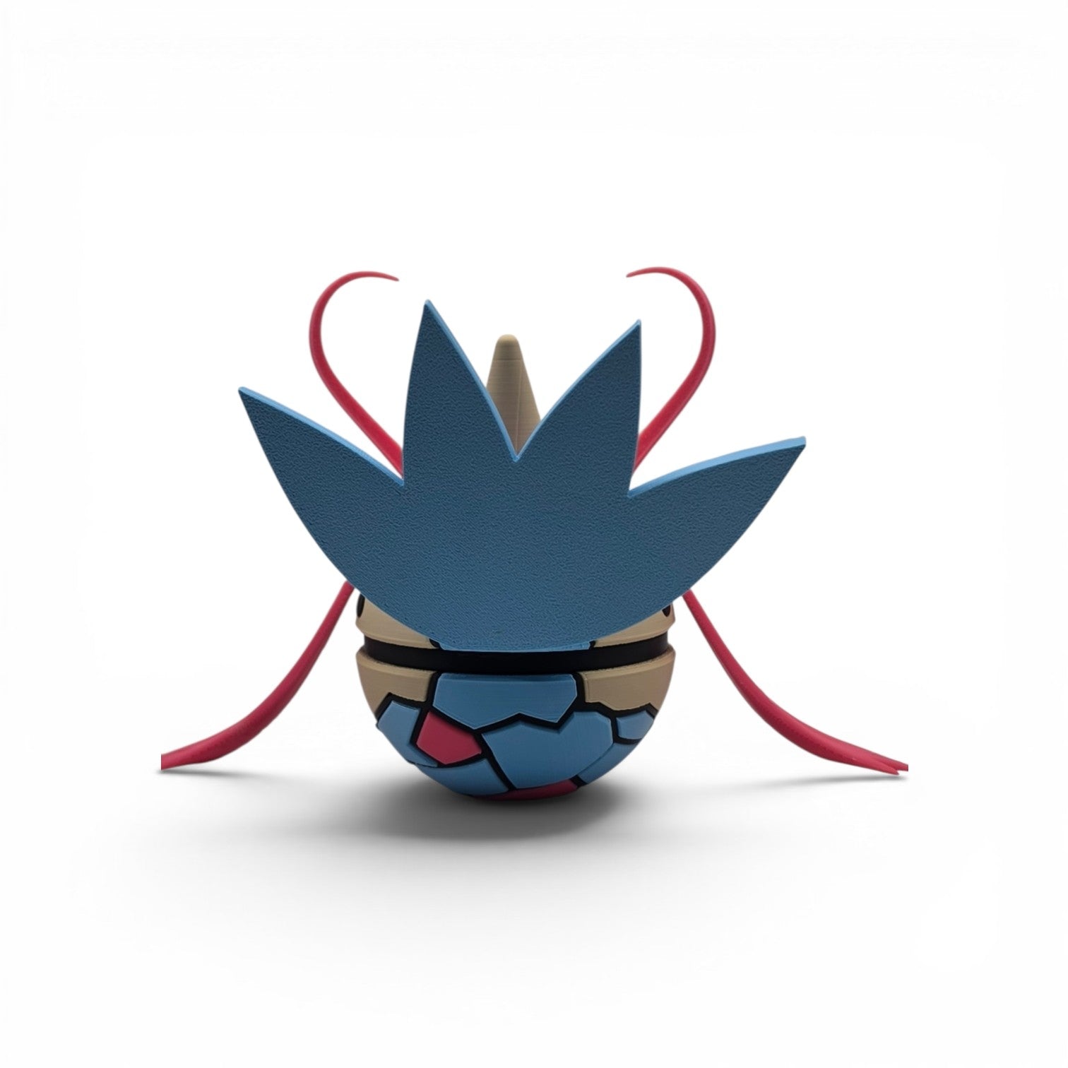 Close up of the creature ball showing blue fan tail and pink oval detail