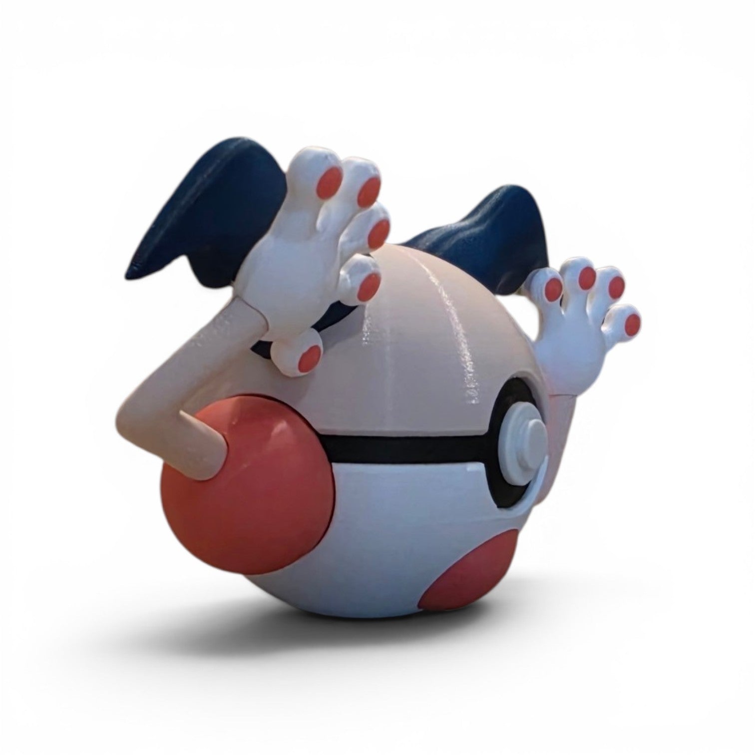 Close up of the creature ball showing blue clown hair tufts and magenta cheek circle detail
