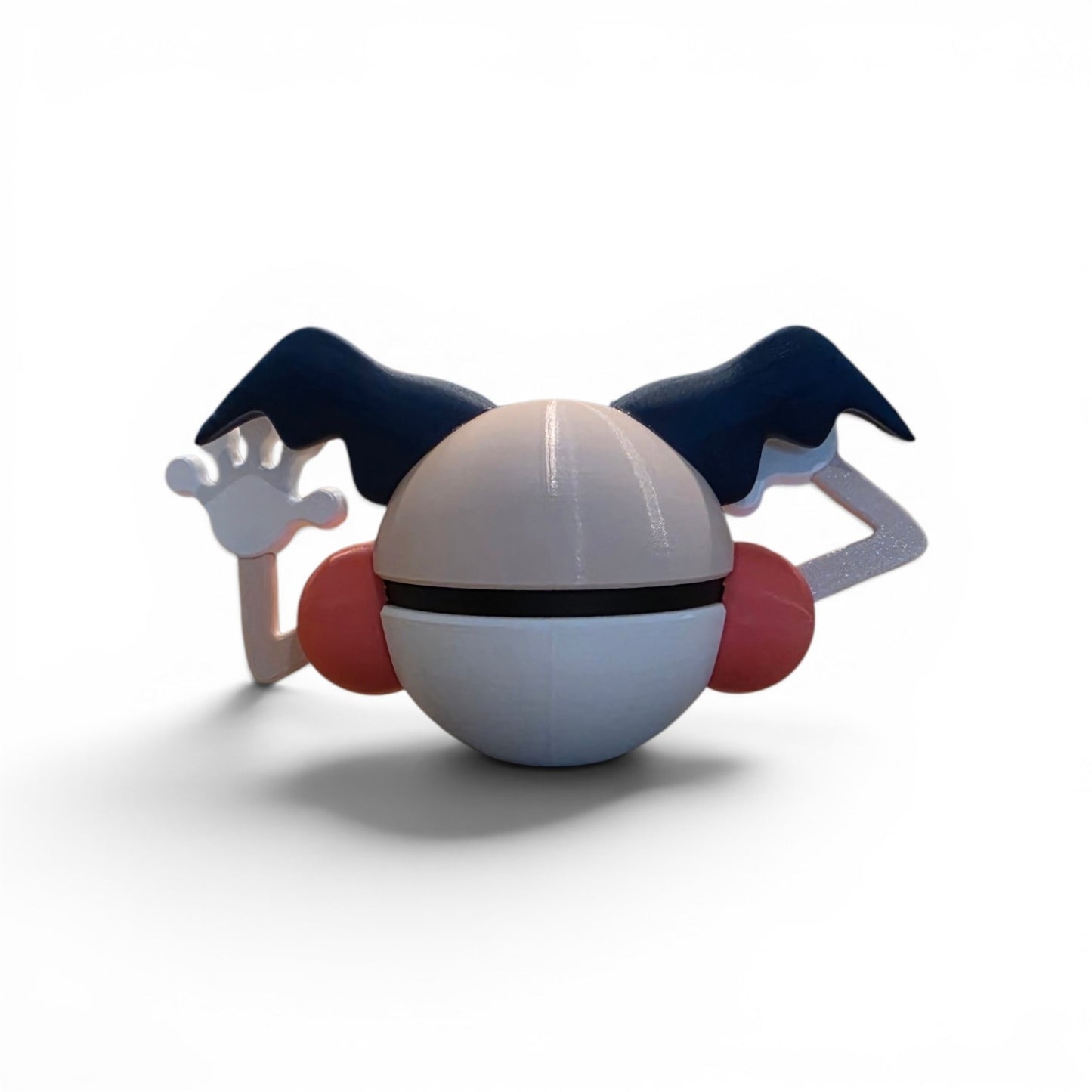 Close up of the creature ball showing white gloved hands with pink fingertip pad detail