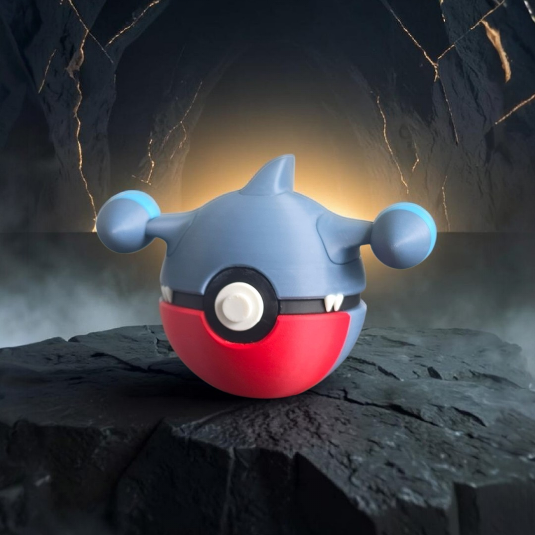 3D printed blue red land shark dragon creature ball on rocky surface