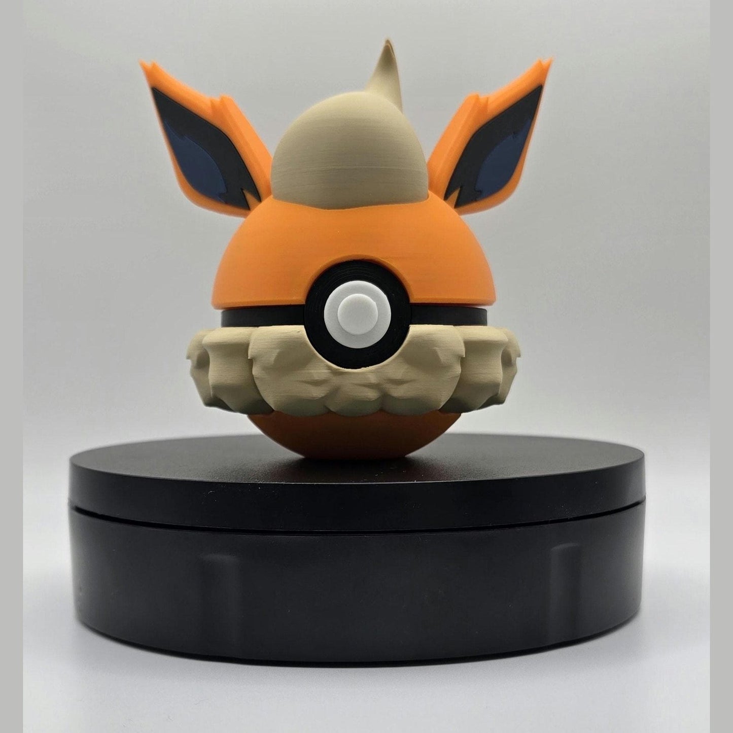 3D printed orange fire fox flame tail creature ball with flared ear detail