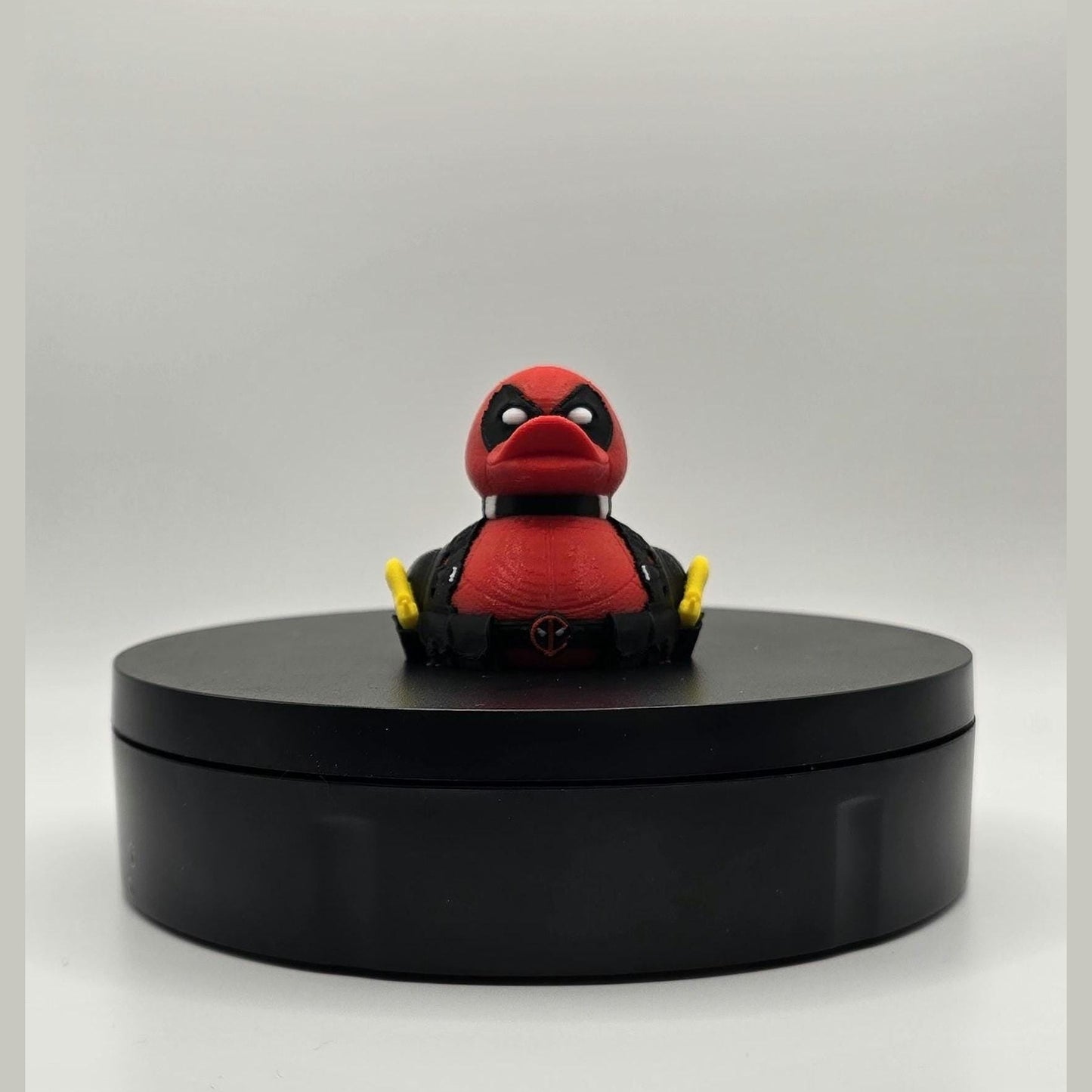 Mercenary DuckPool – Red Suit Antihero-Inspired Display Figure
