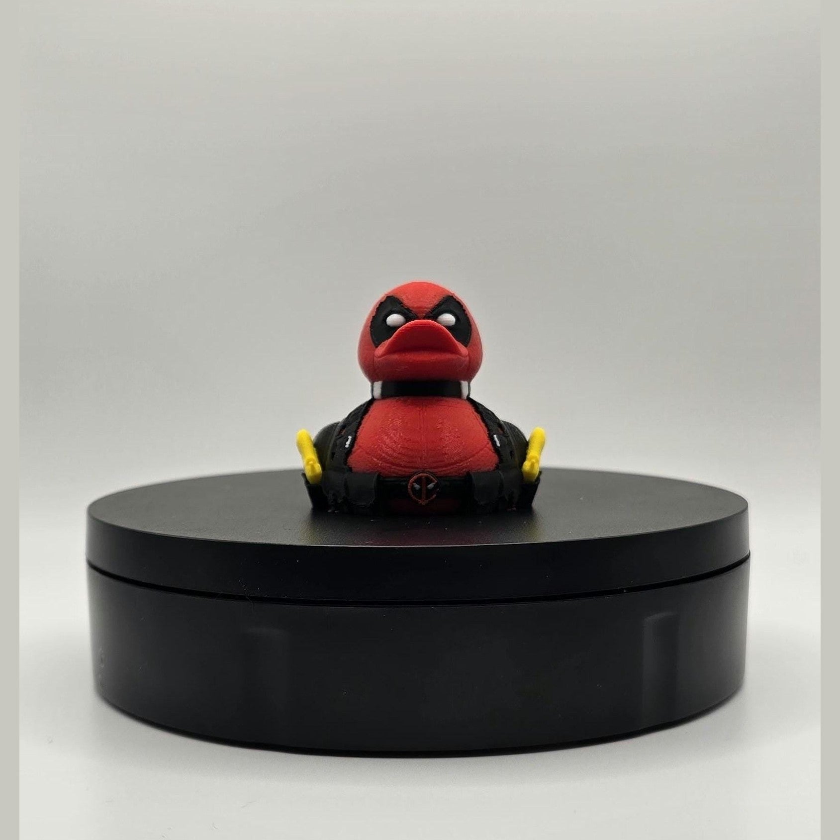 Mercenary DuckPool – Red Suit Antihero-Inspired Display Figure