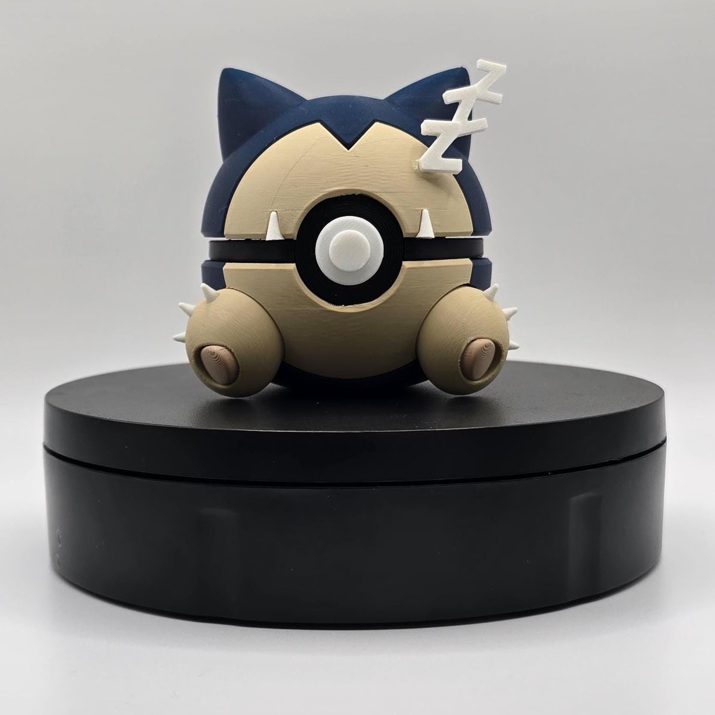 3D printed navy and tan sleepy giant nap king creature ball with Z detail