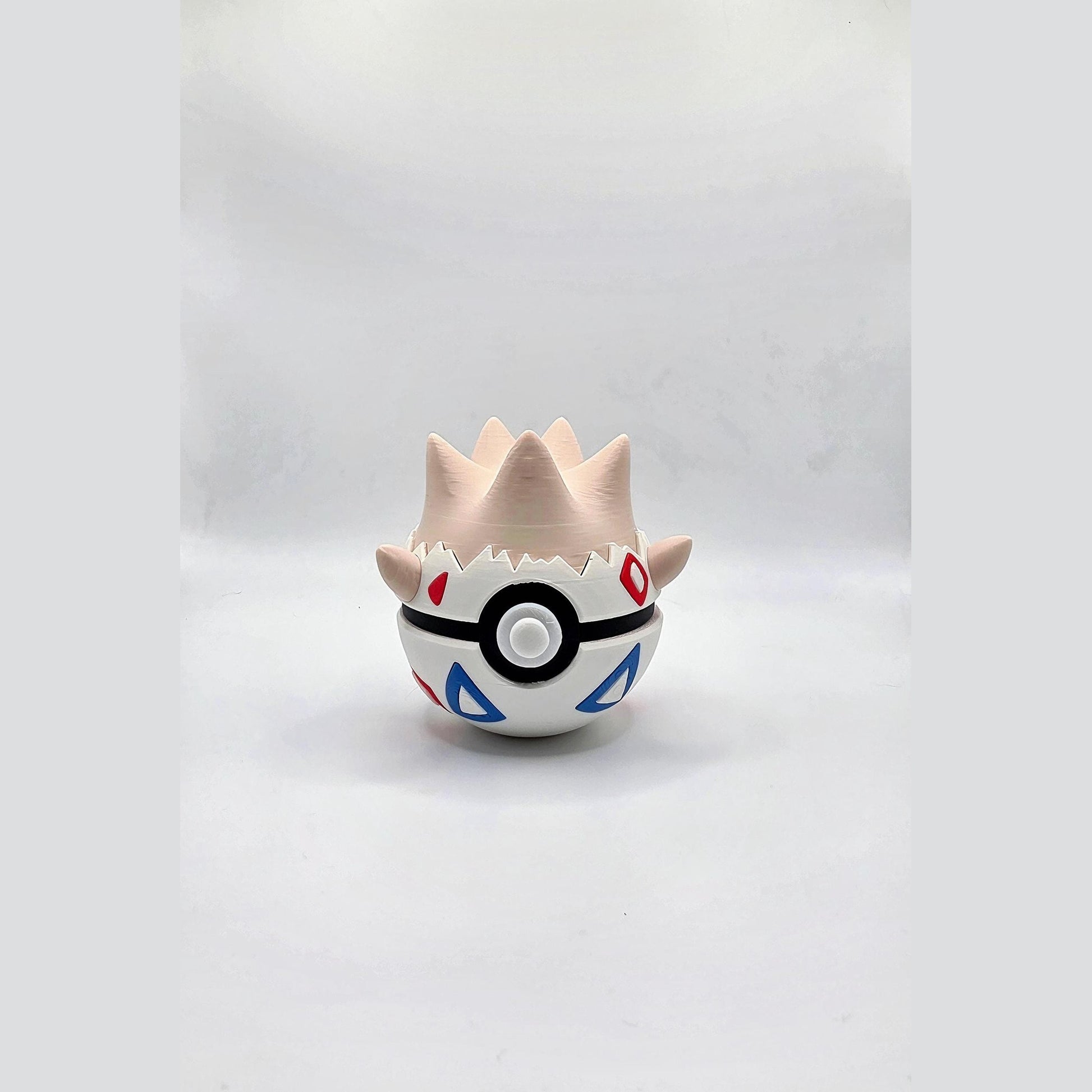 3D printed eggshell baby creature ball with geometric shell pattern accents