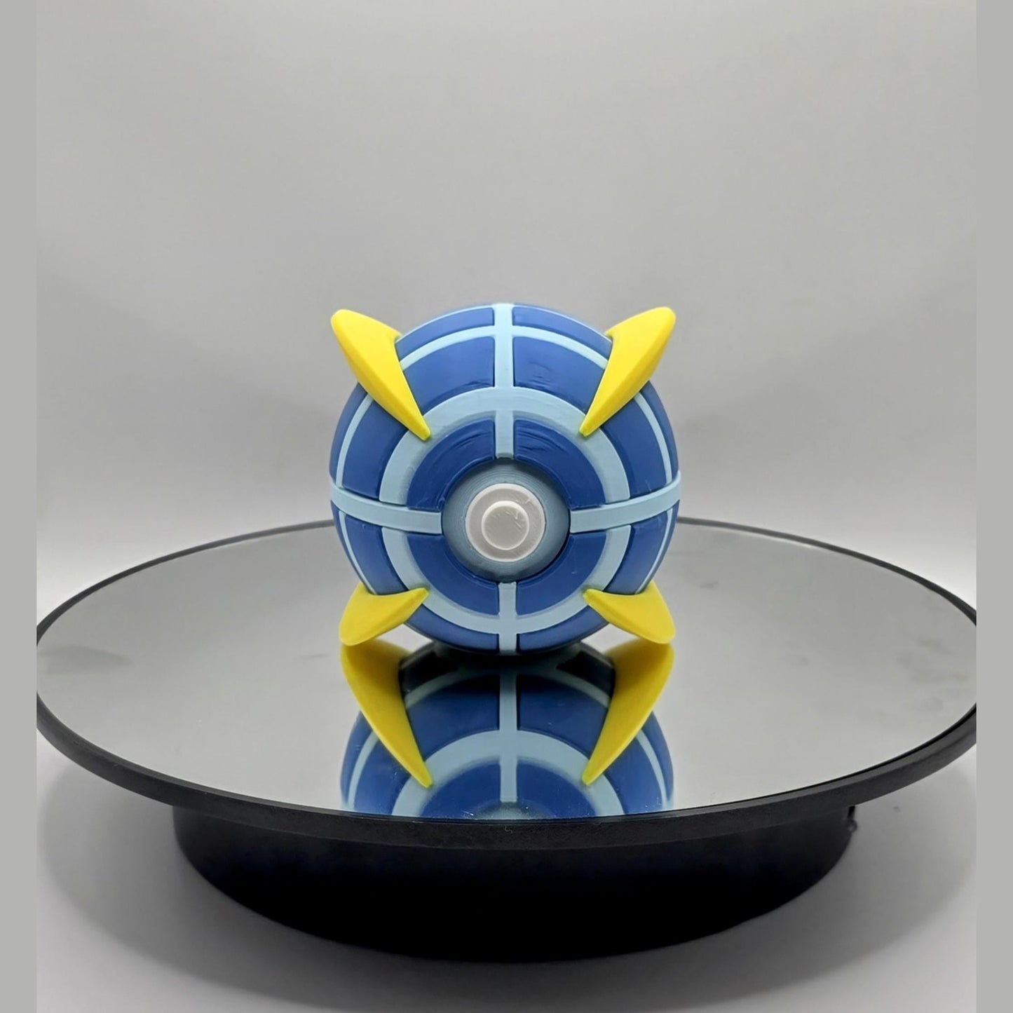Fan Fusion Collector Ball: Blue & Yellow Geometric Design