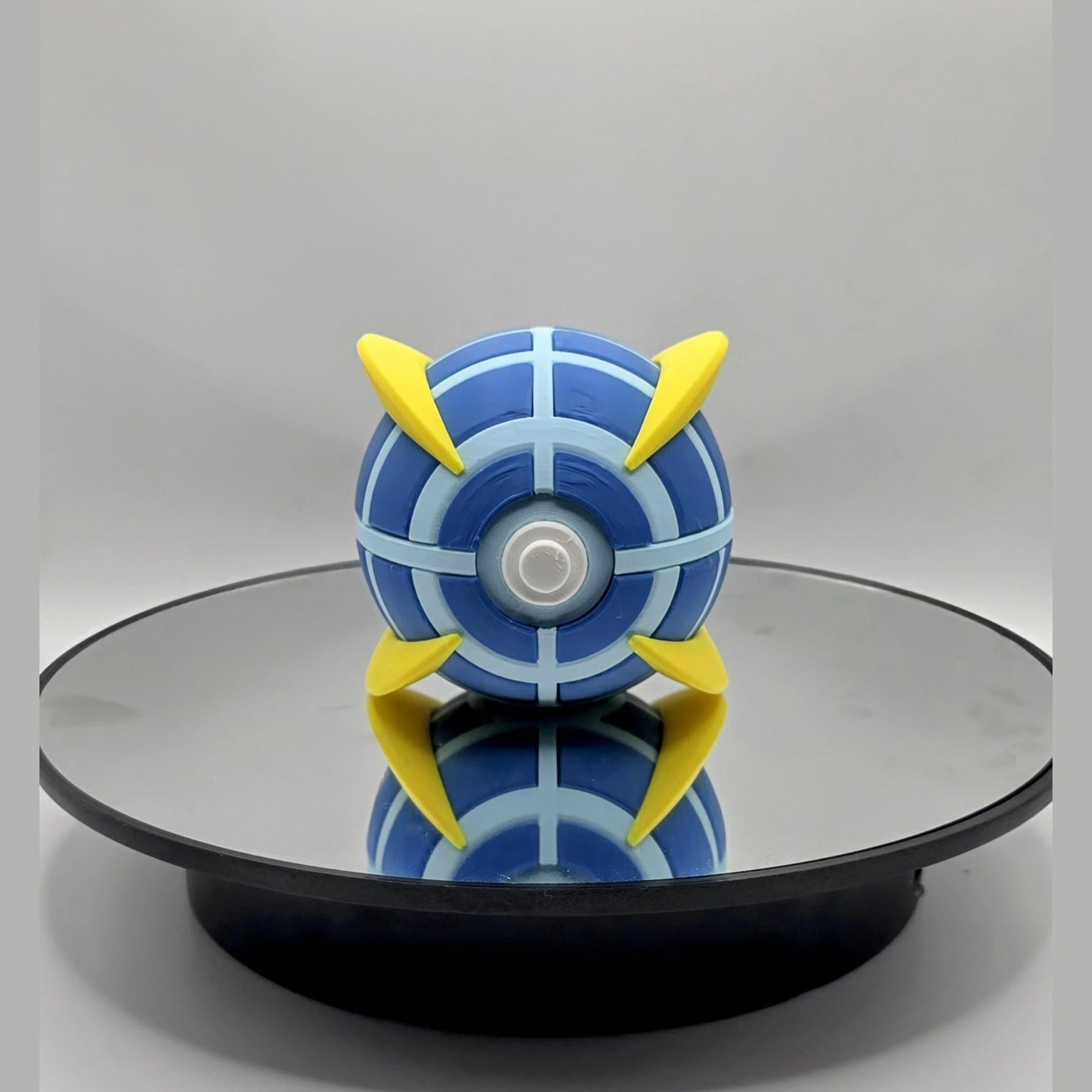 Fan Fusion Collector Ball: Blue & Yellow Geometric Design