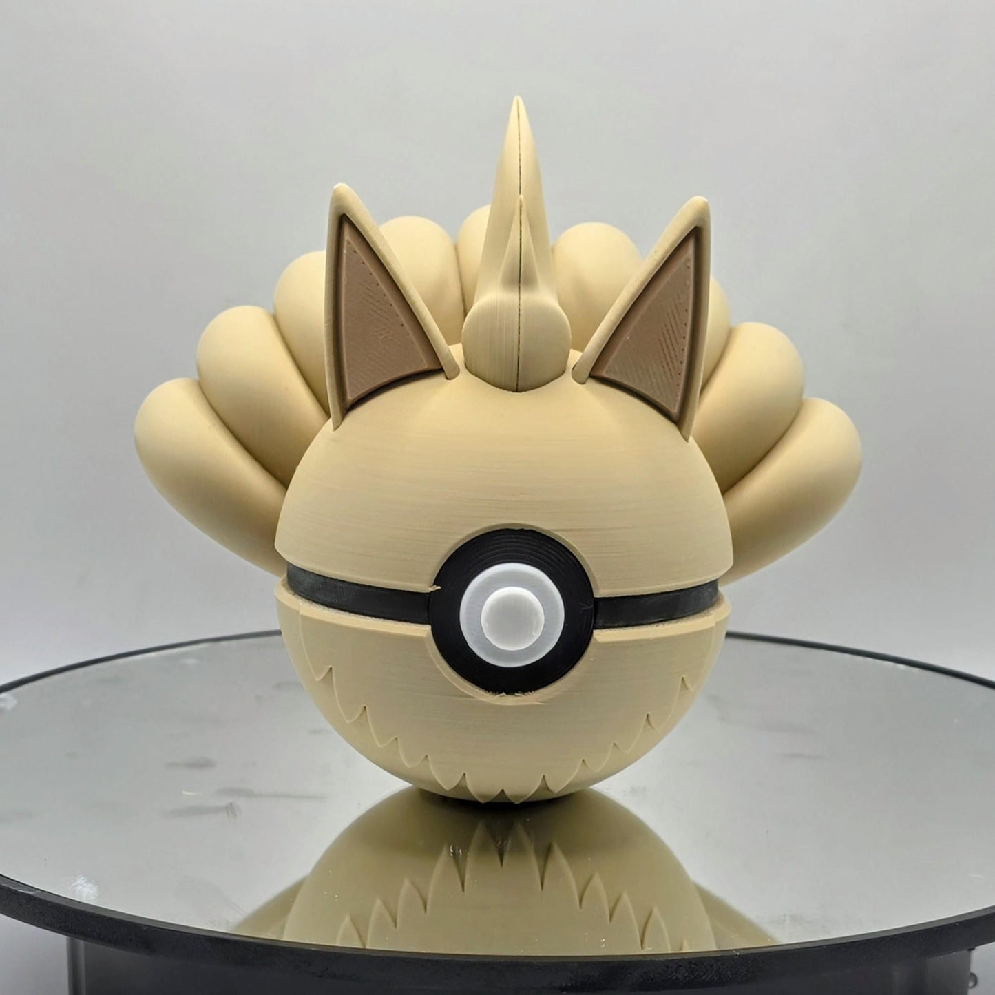 3D printed cream nine tail fox creature ball with sculpted tail array