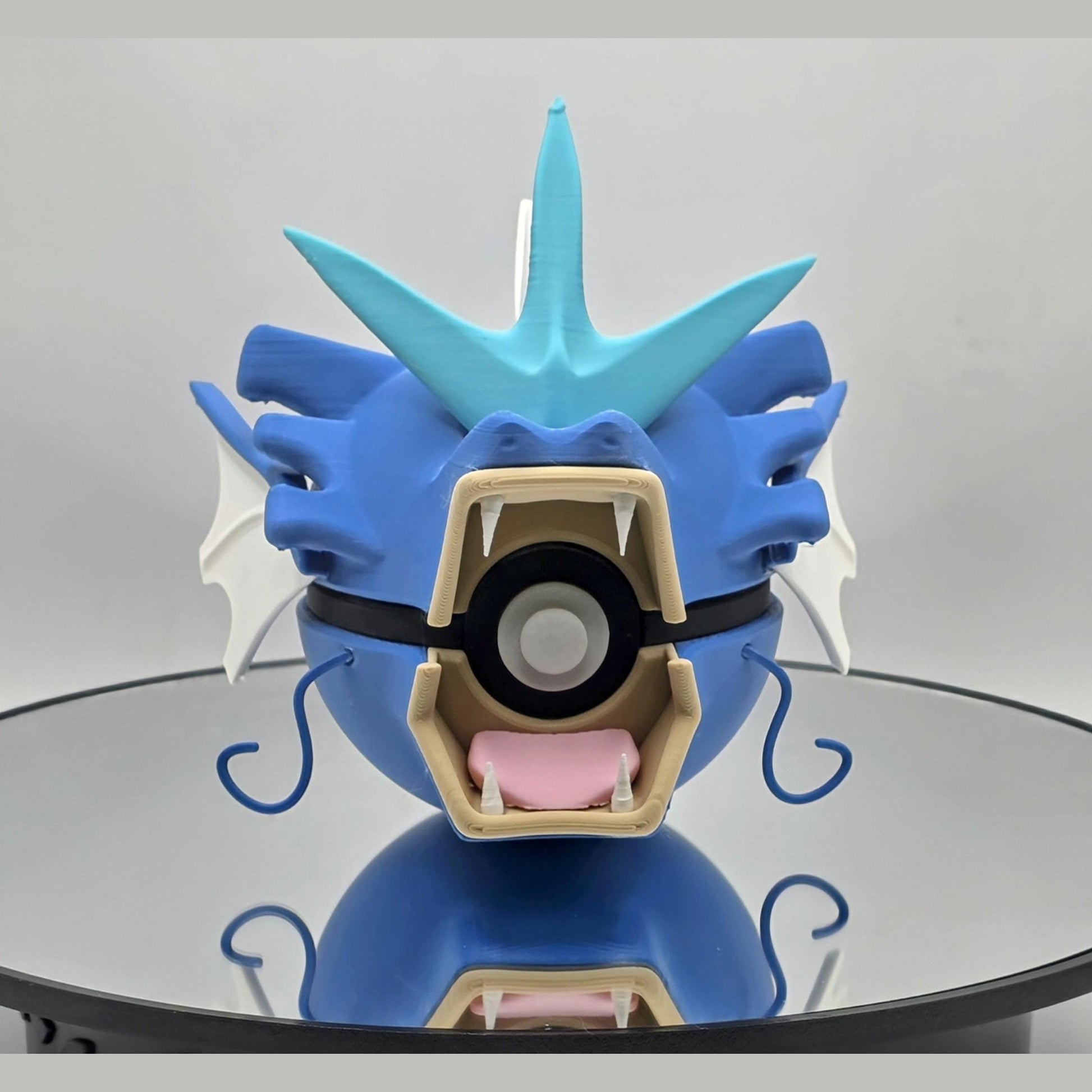 3D printed blue sea serpent water creature ball with bold fangs and fins