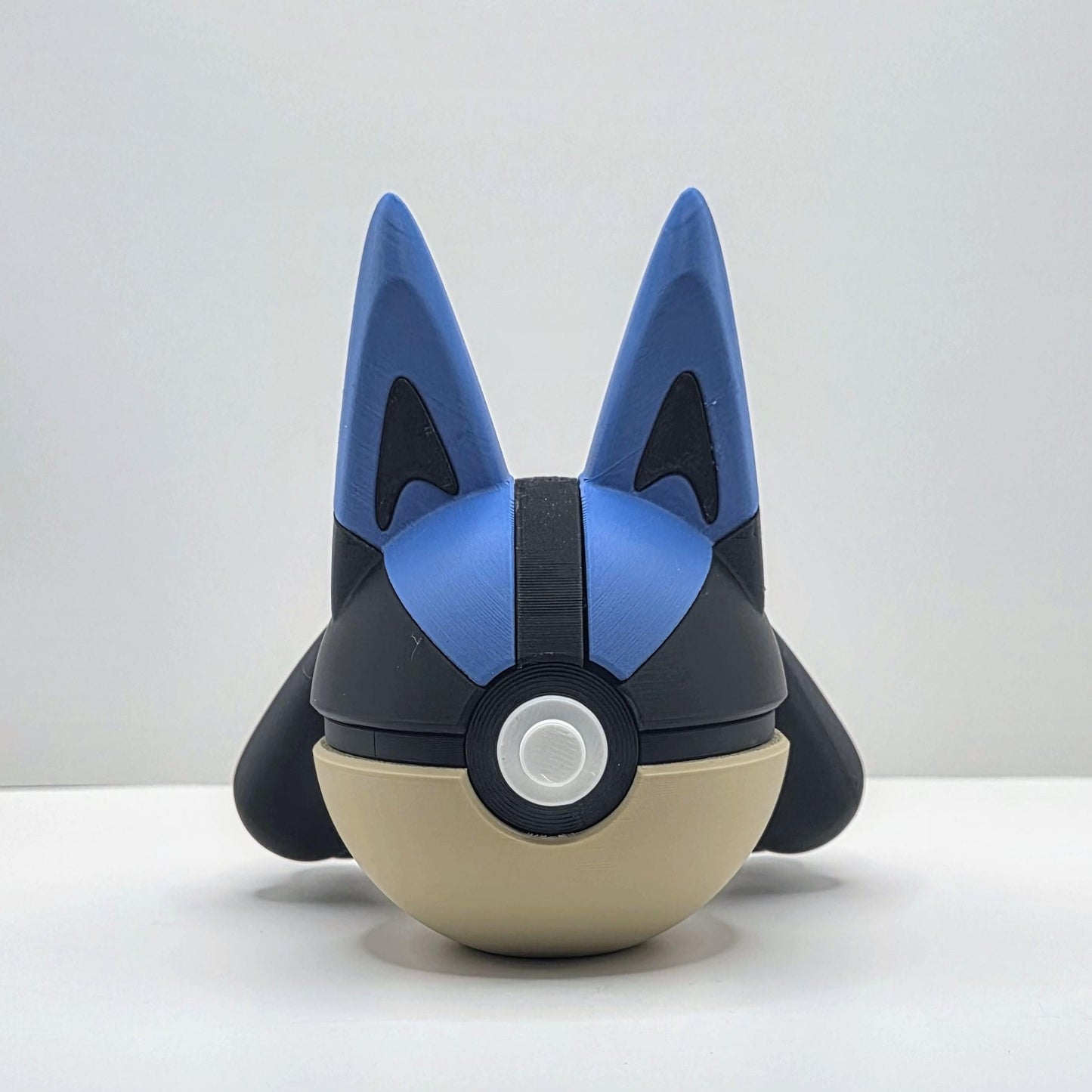 3D printed blue aura warrior steel spirit creature ball with gold accent detail