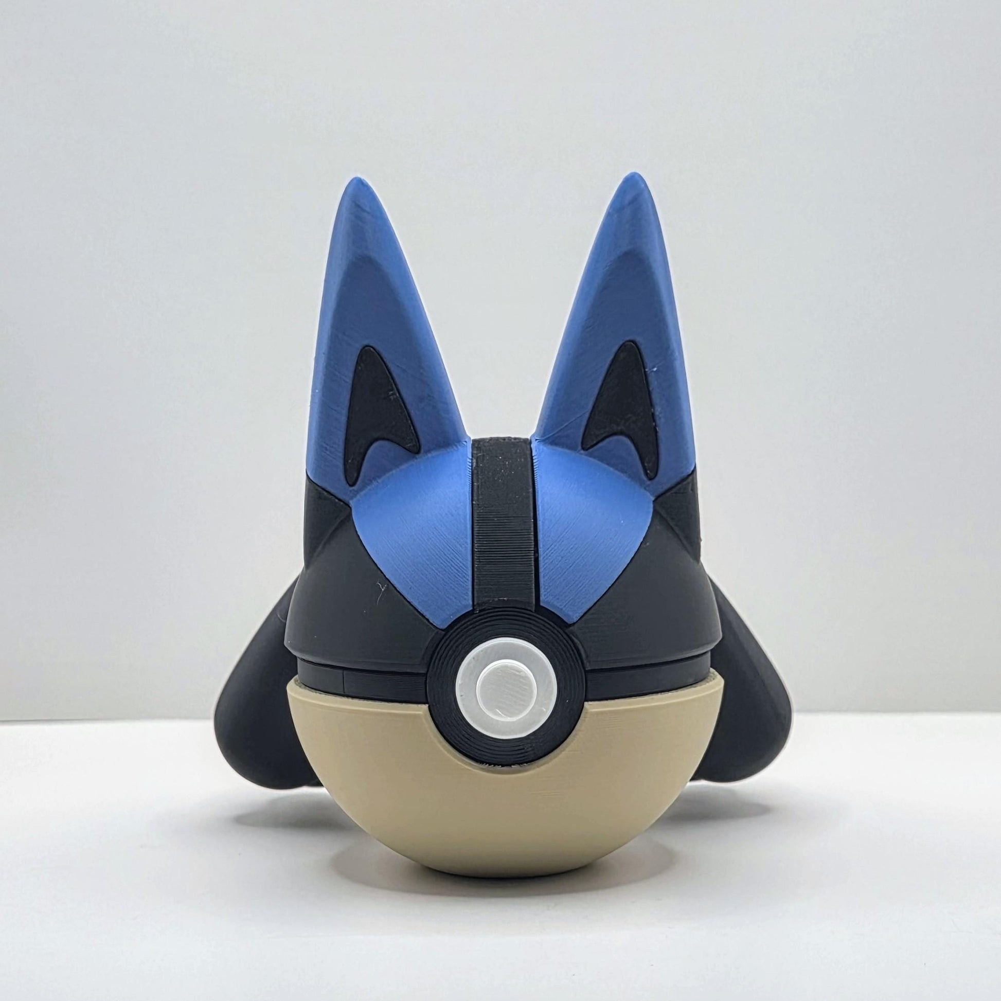 3D printed blue aura warrior steel spirit creature ball with gold accent detail