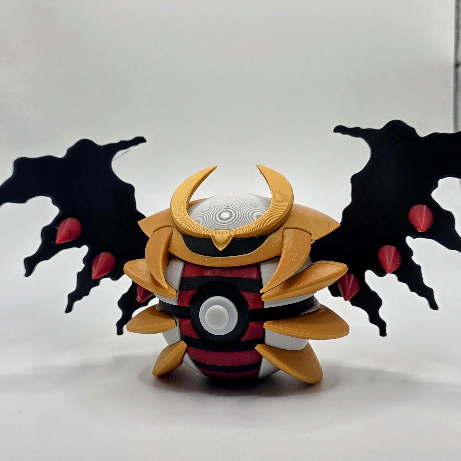 3D printed distortion dragon collector ball with black shadow wings and crimson striped armor