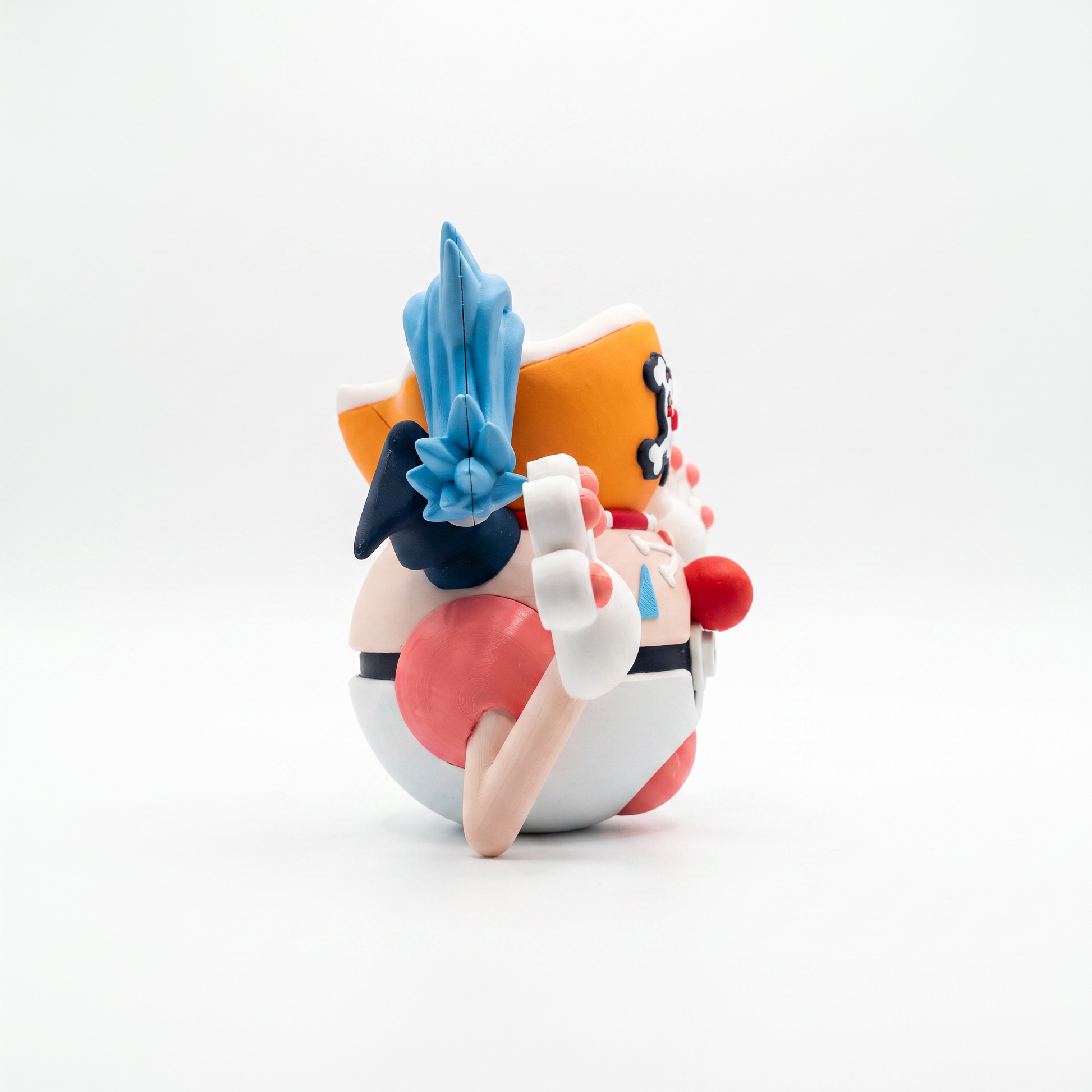 Close up of the creature ball showing red clown nose and red and white striped shirt body detail