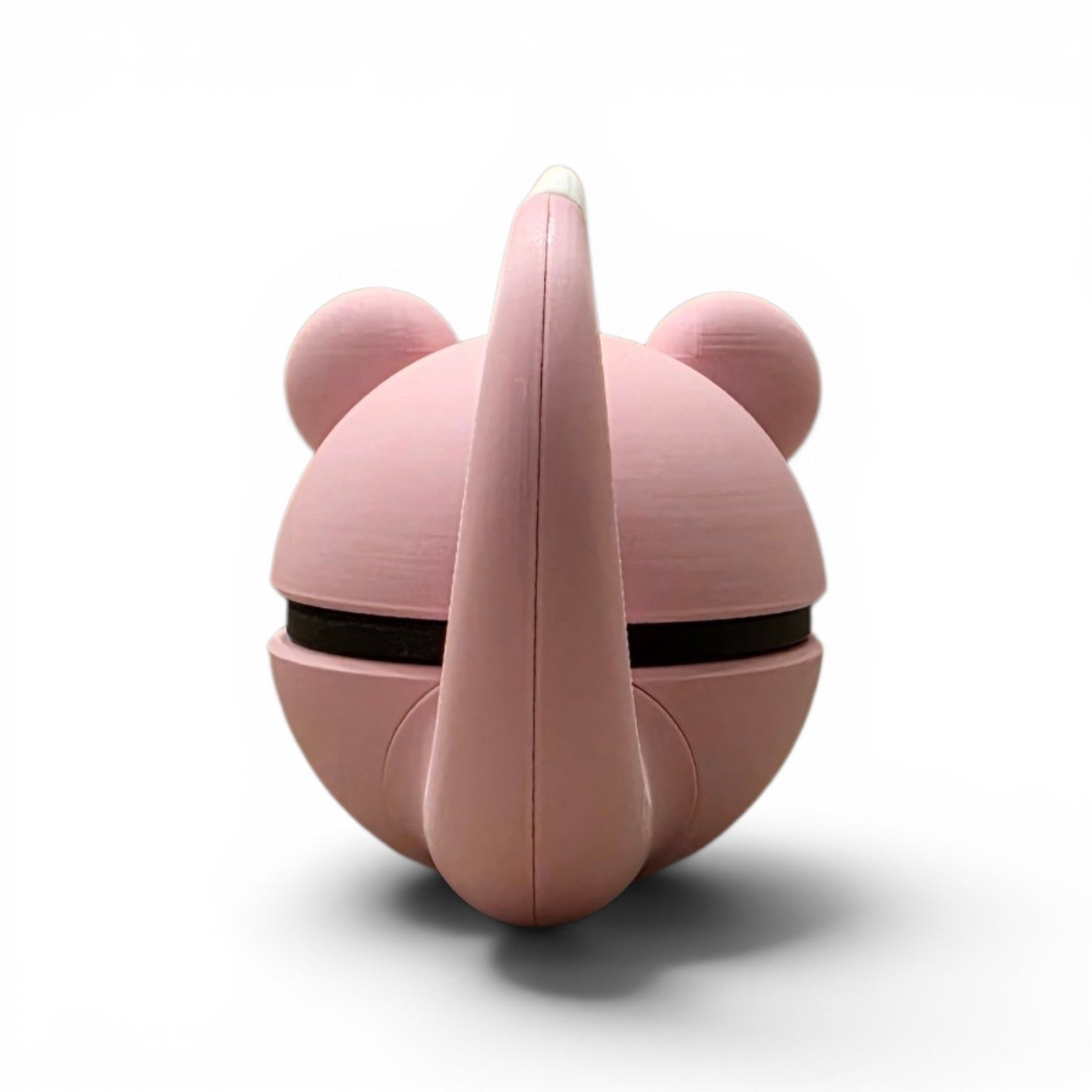 Close up of the creature ball showing curly ears and soft pink upper body detail