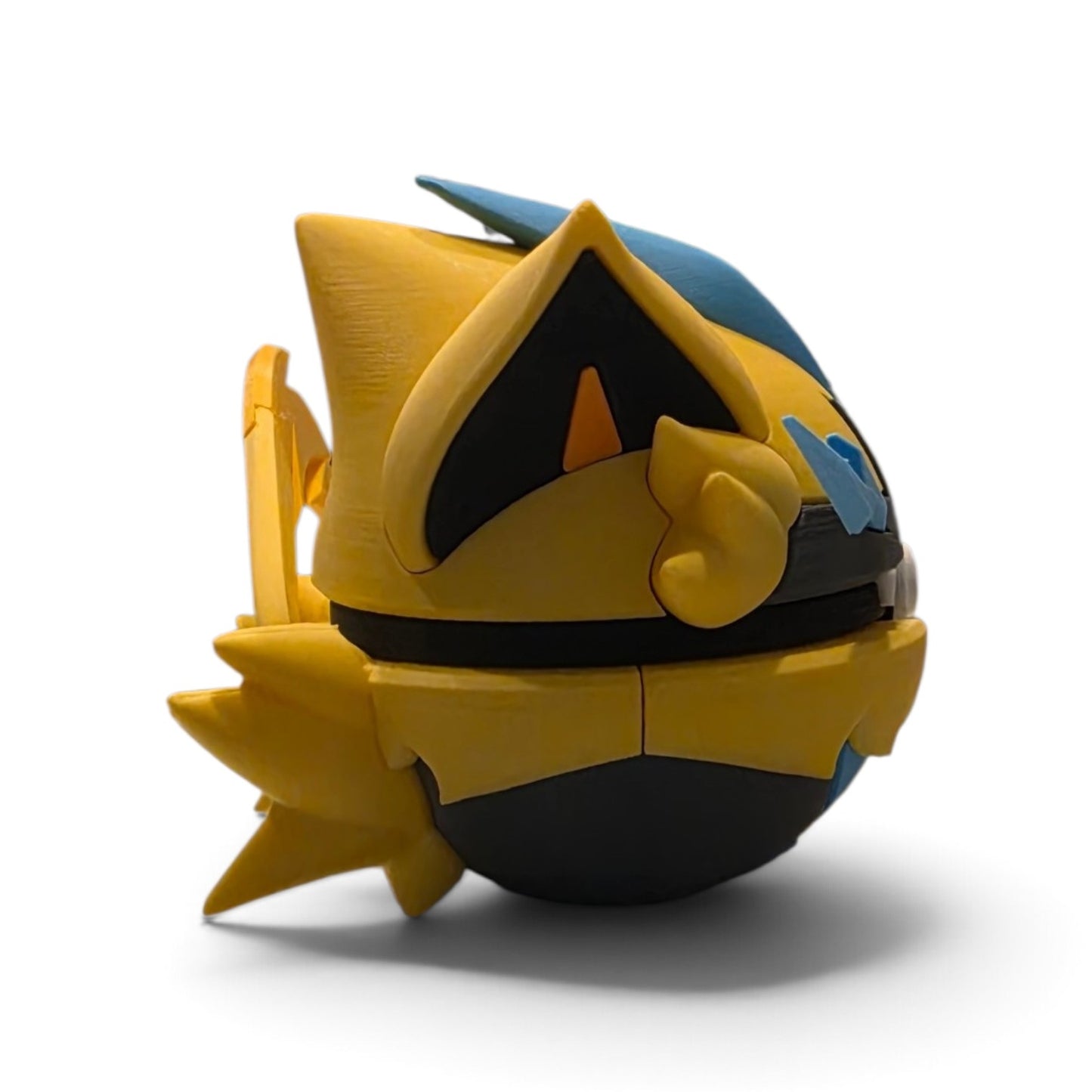 Close up of the creature ball showing lightning bolt-shaped fur tail and dark grey lower body contrast