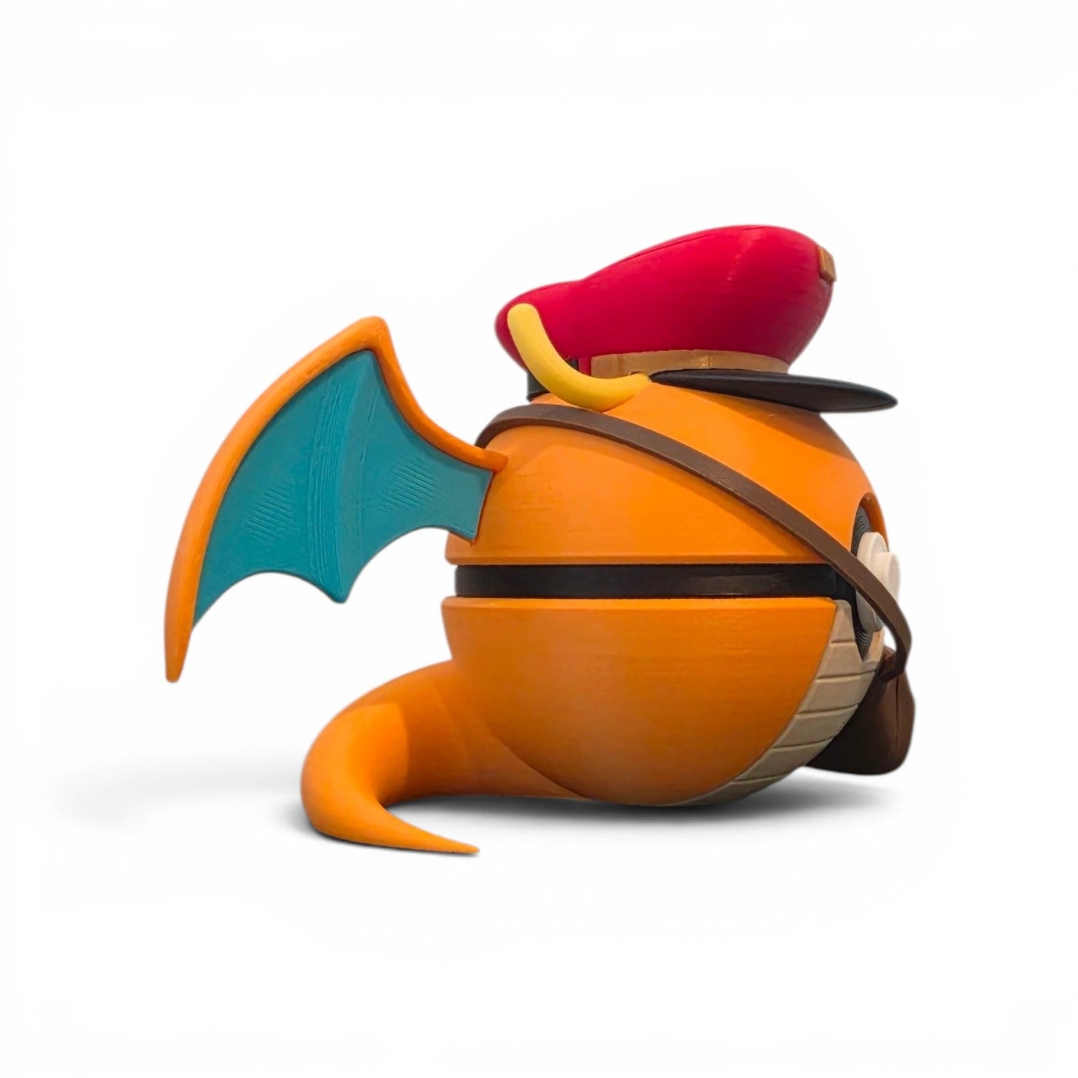 Close up of the creature ball showing red postal cap with gold badge and yellow antennae horns