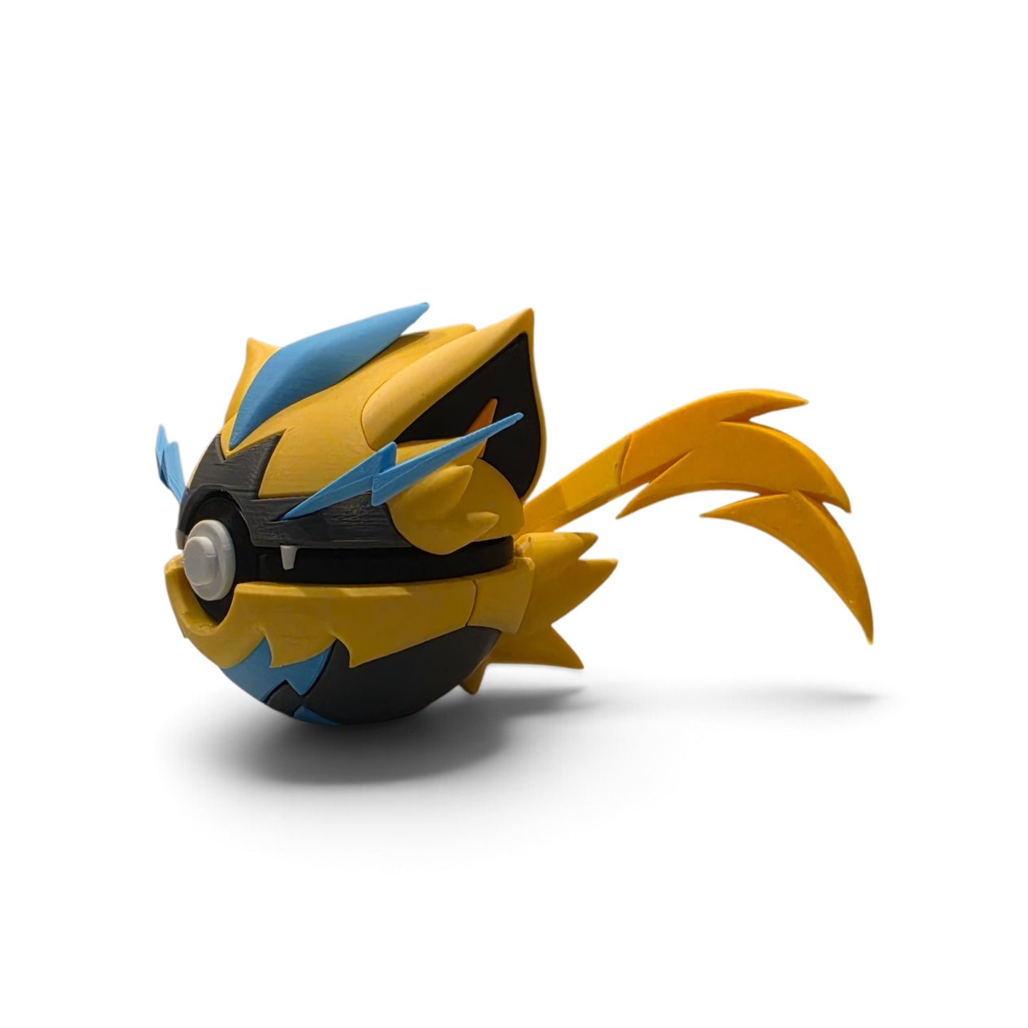 Close up of the creature ball showing blue forehead spike and bolt-shaped whisker detail