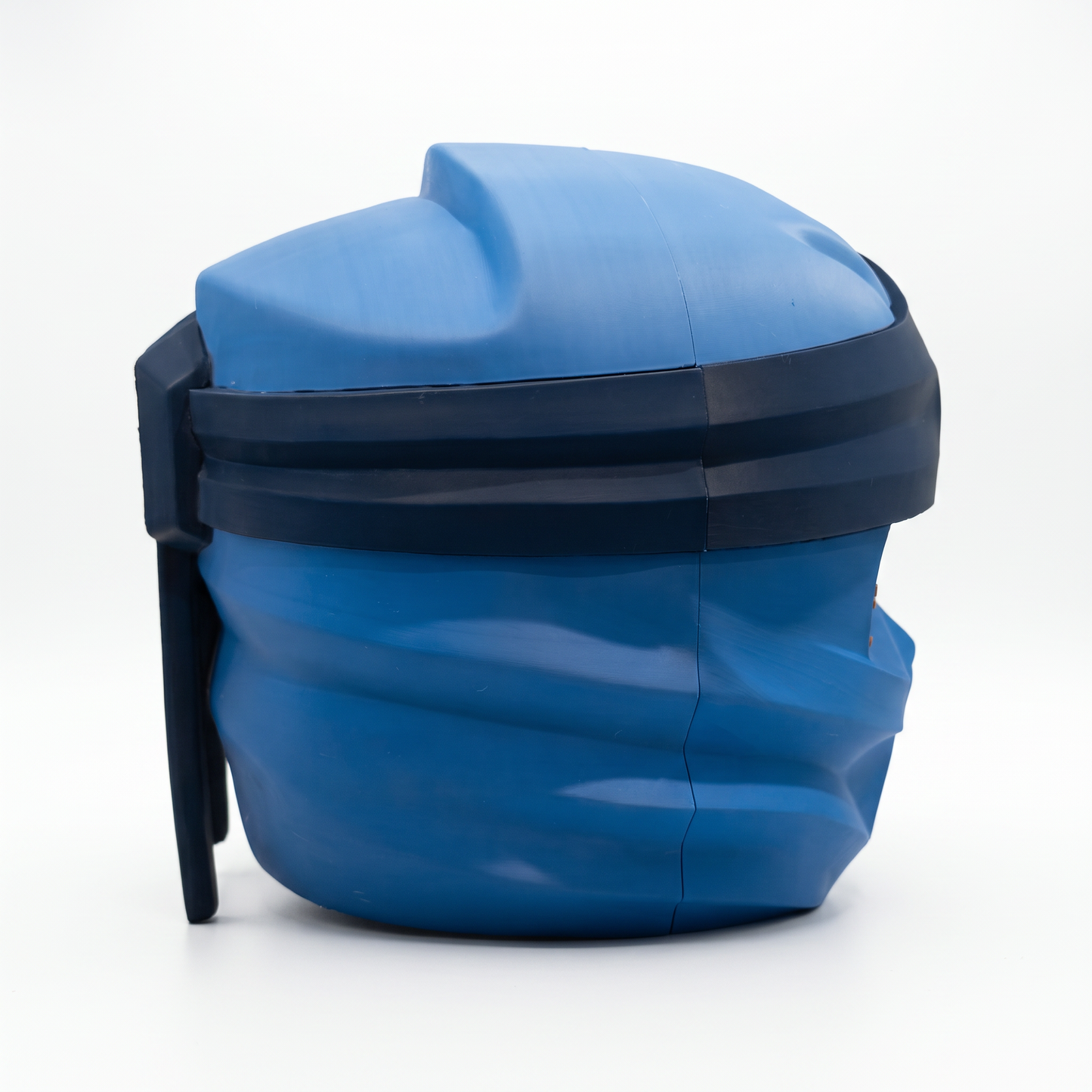 Close up of the ninja helmet showing layered blue face guard and angular chin detail
