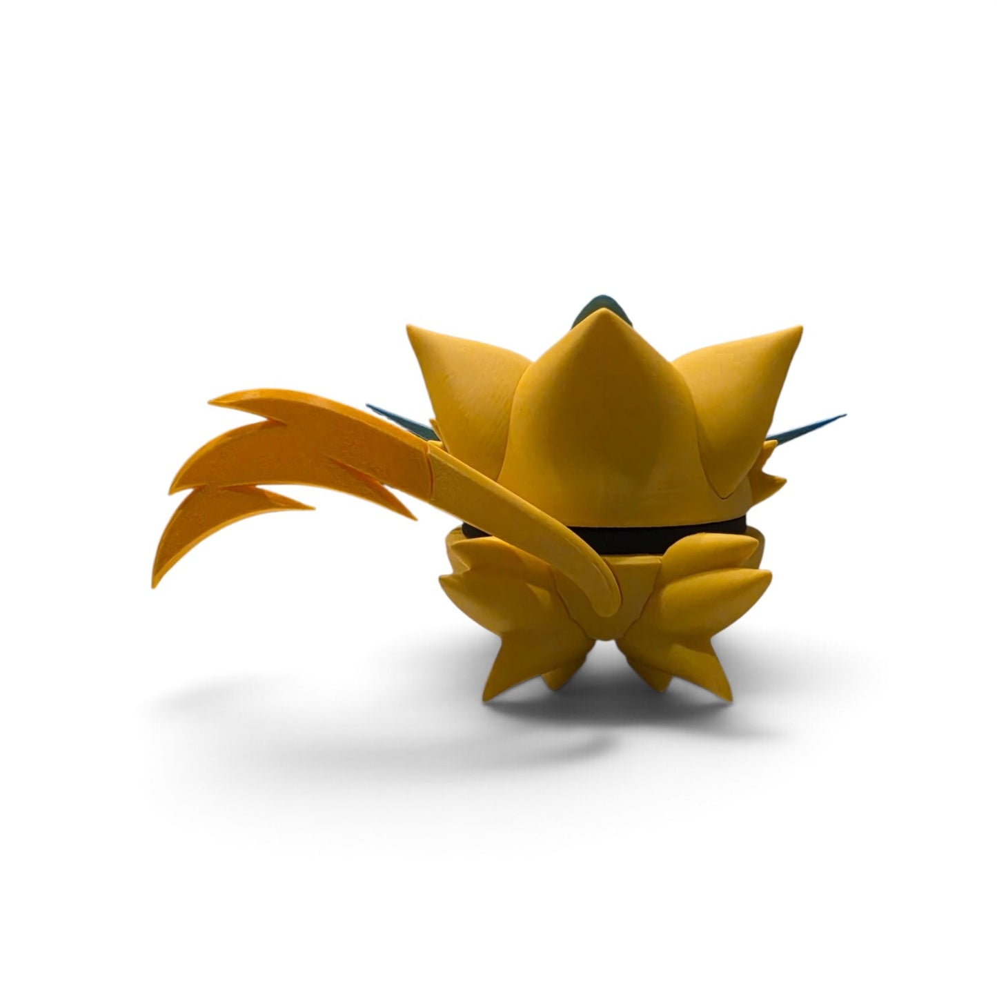 Close up of the creature ball showing black lightning bolt markings and jagged stripe detail on arms