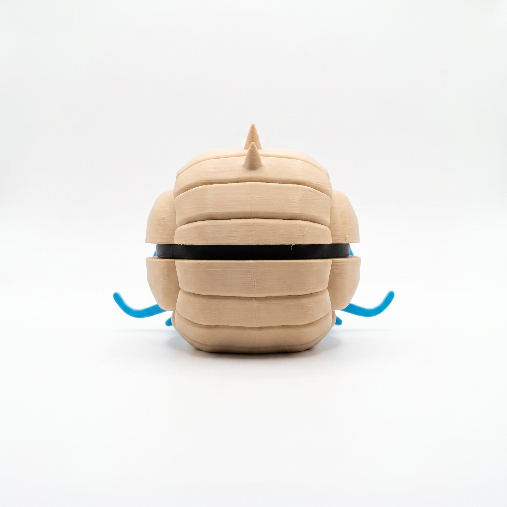 Close up of the spiky shell creature ball showing full side profile with spike crown and blue tentacles
