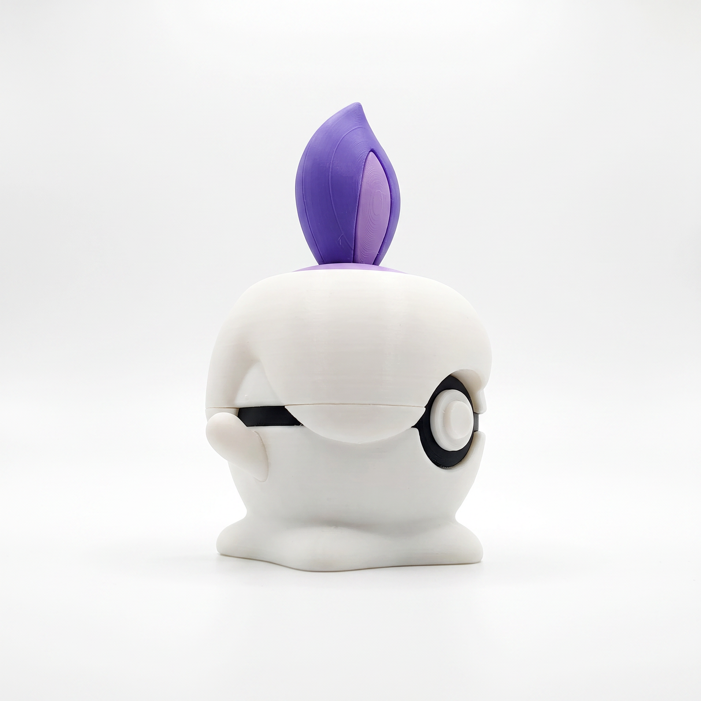 Close up of the creature ball showing purple dual-tone flame and lavender wax cap detail on top