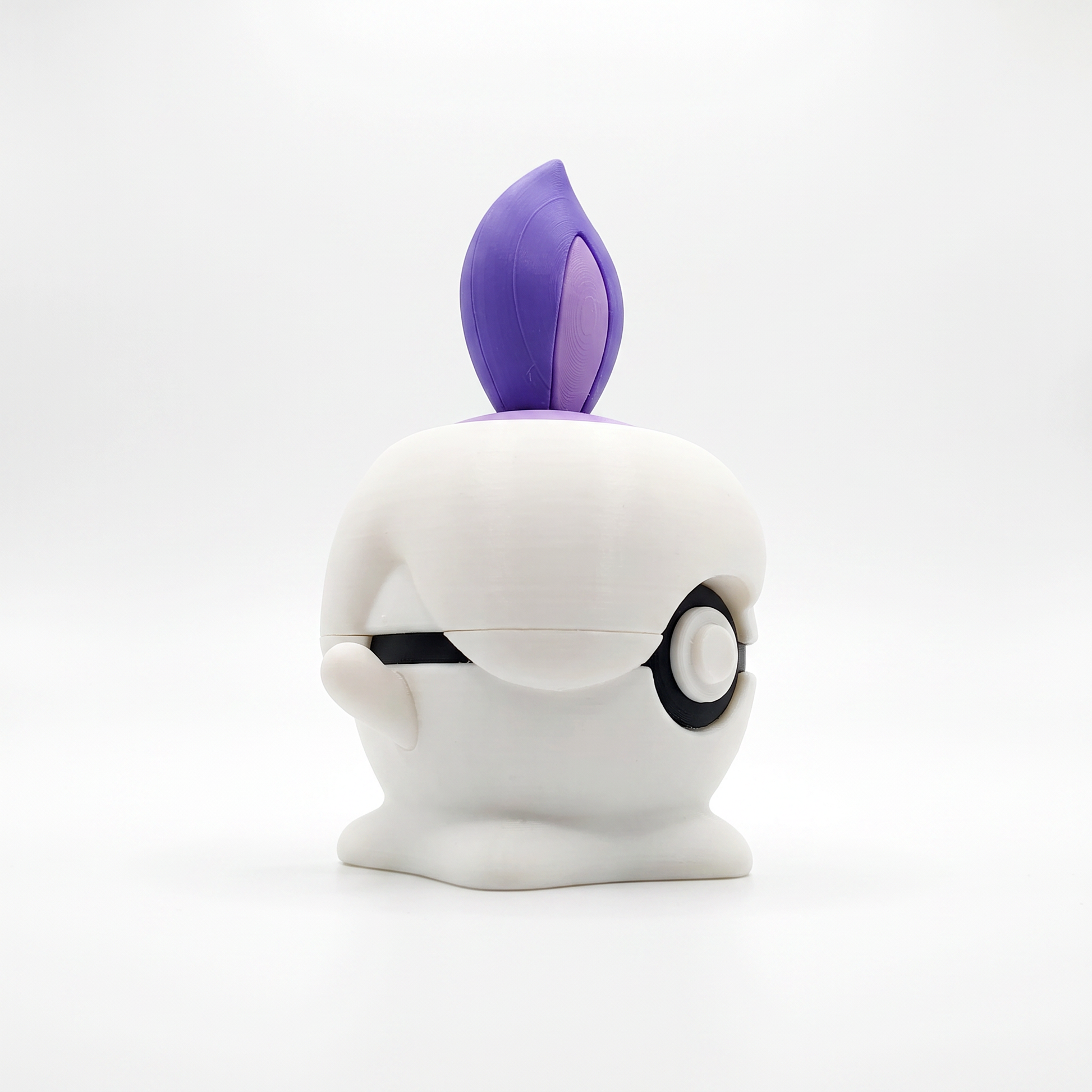 Close up of the creature ball showing purple dual-tone flame and lavender wax cap detail on top