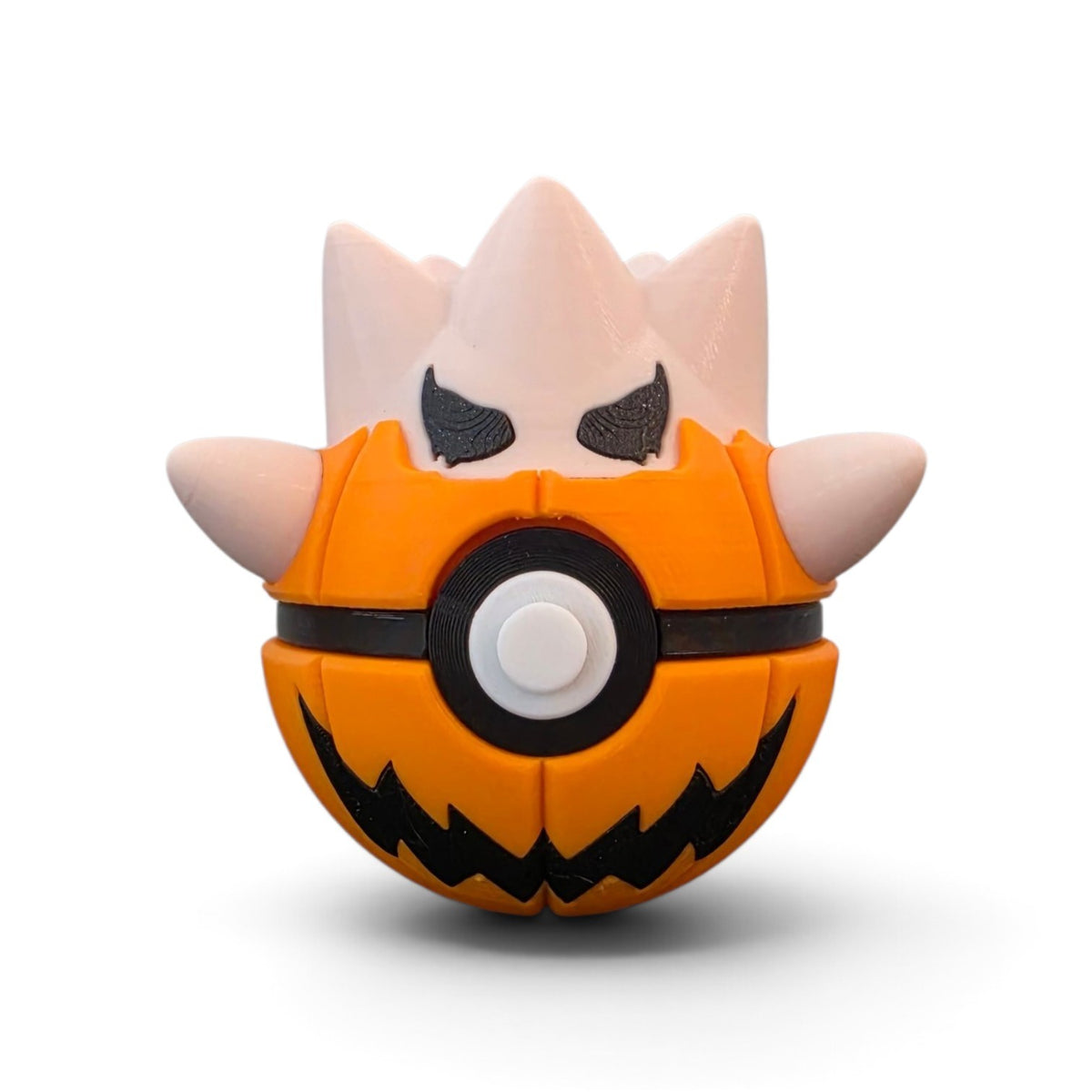 Jack-o-lantern egg hatchling creature ball front view showing carved grin and eyes