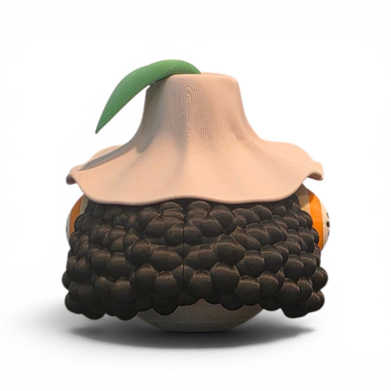 Close up of the creature ball showing brown wide brimmed hat and orange goggle detail on top